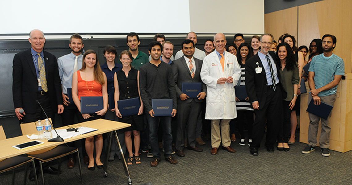 GW clinical health participants pose with faculty and administrators