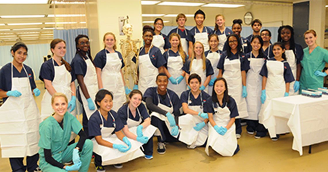 Camp Cardiac student participants pose in lab