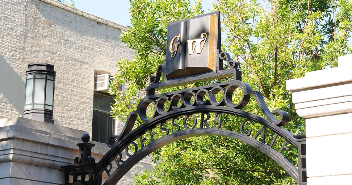 GW symbol on a campus gate overlooking campus