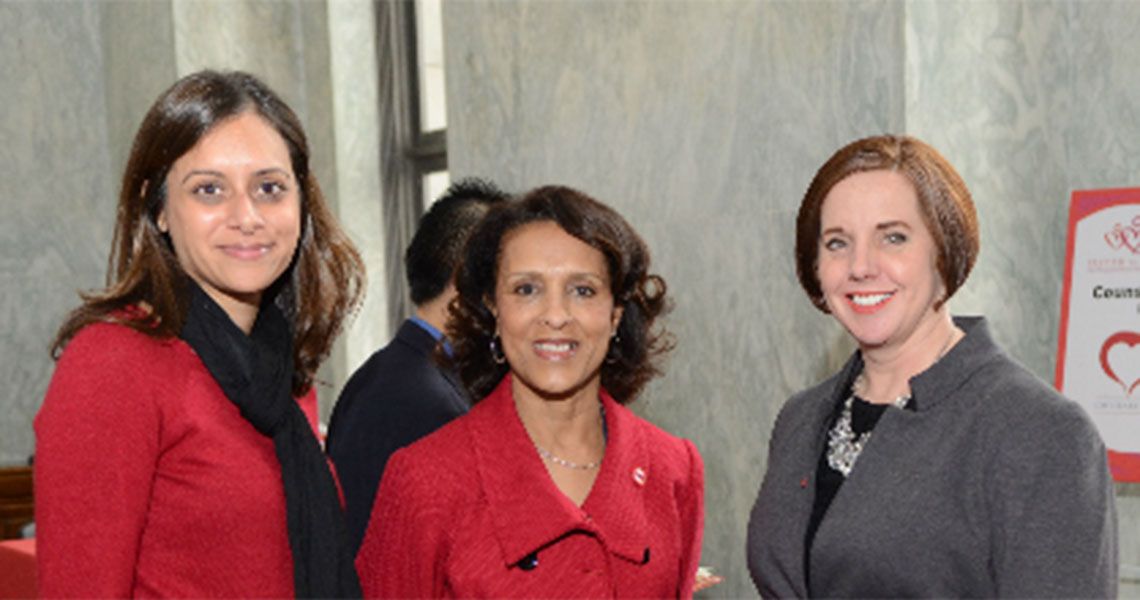 Three women pose for photo