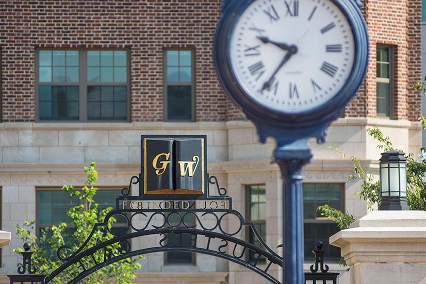 A George Washington University campus archway and a street clock