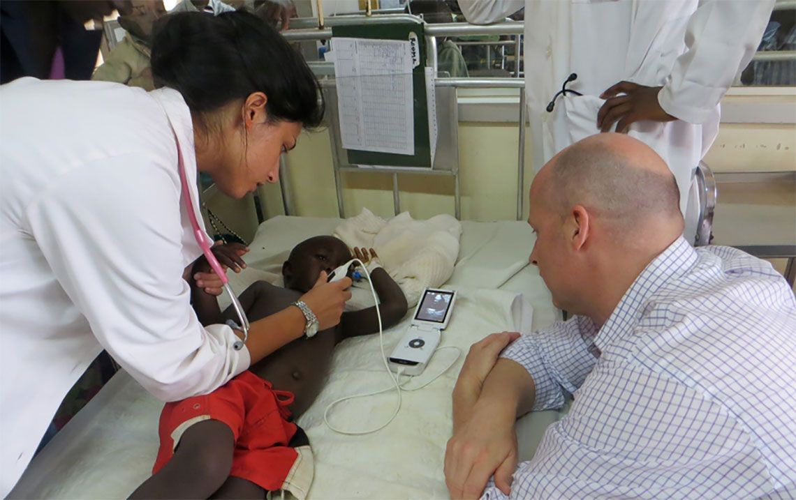 Dr. Keith Boniface supervises an ultrasound on a child
