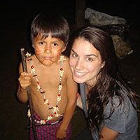 Jacqueline Phillips poses with an indigenous child