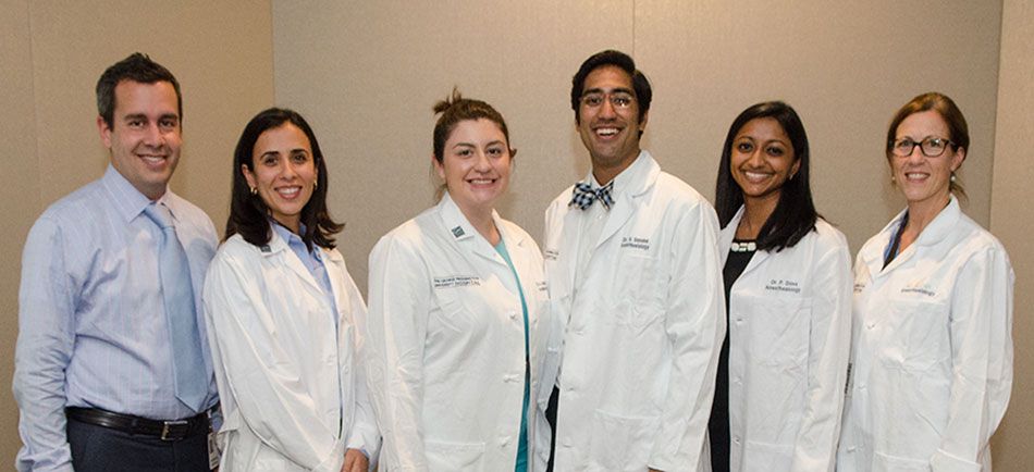 SMHS Residents pose in their long white coats 