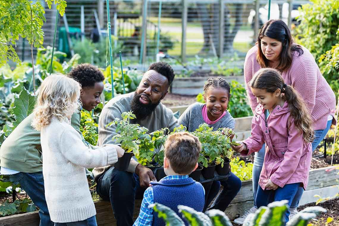 Children and adults in a community garden