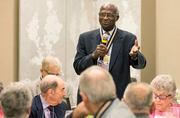Cecil Jonas speaking to a room of people