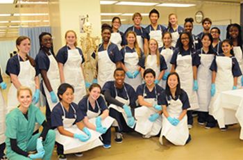 Camp Cardiac student participants pose in lab