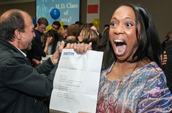 DiAnne Davis shows off her match letter with a scream of excitement
