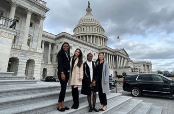 Four HCOP students posing on the steps of the U.S. Capitol