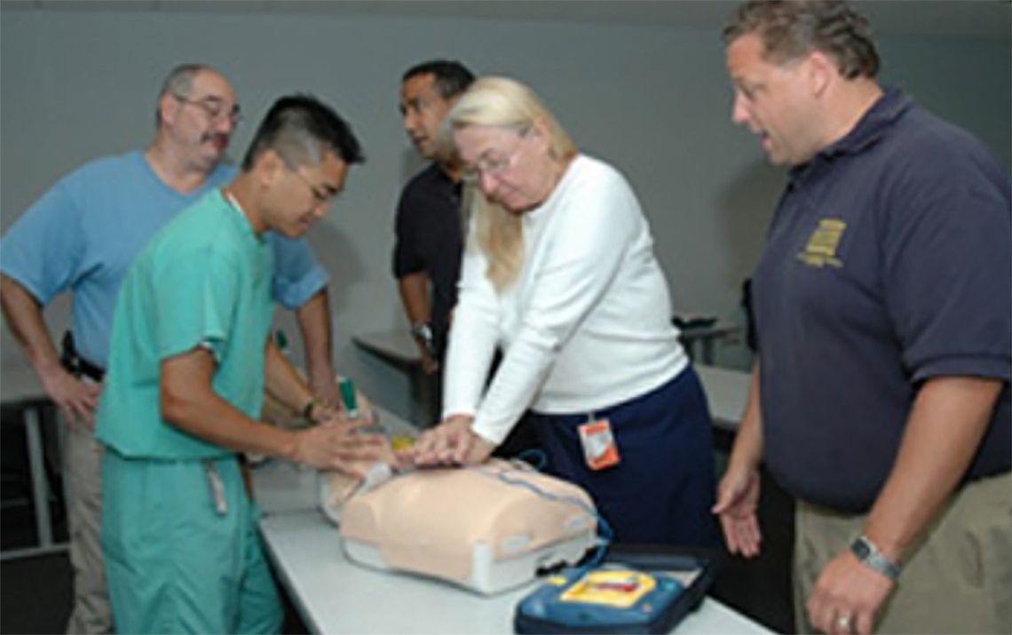Medical associates and faculty working to preform CPR