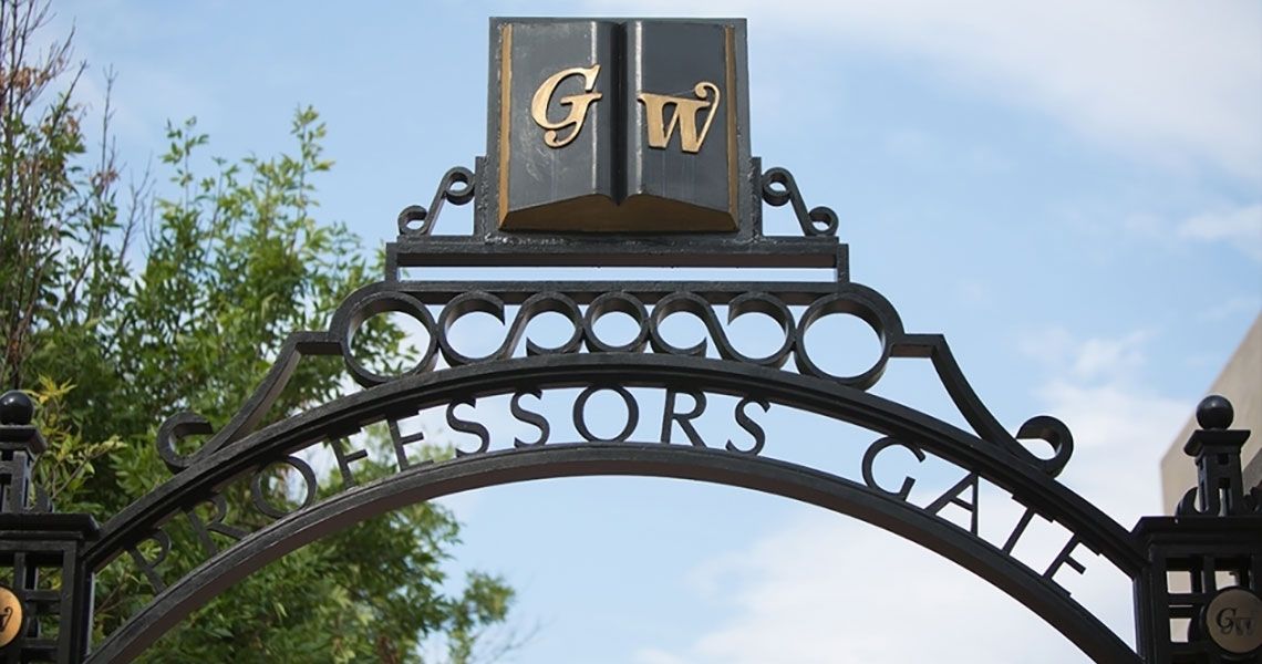 GW Professors Gate in front of a blue sky