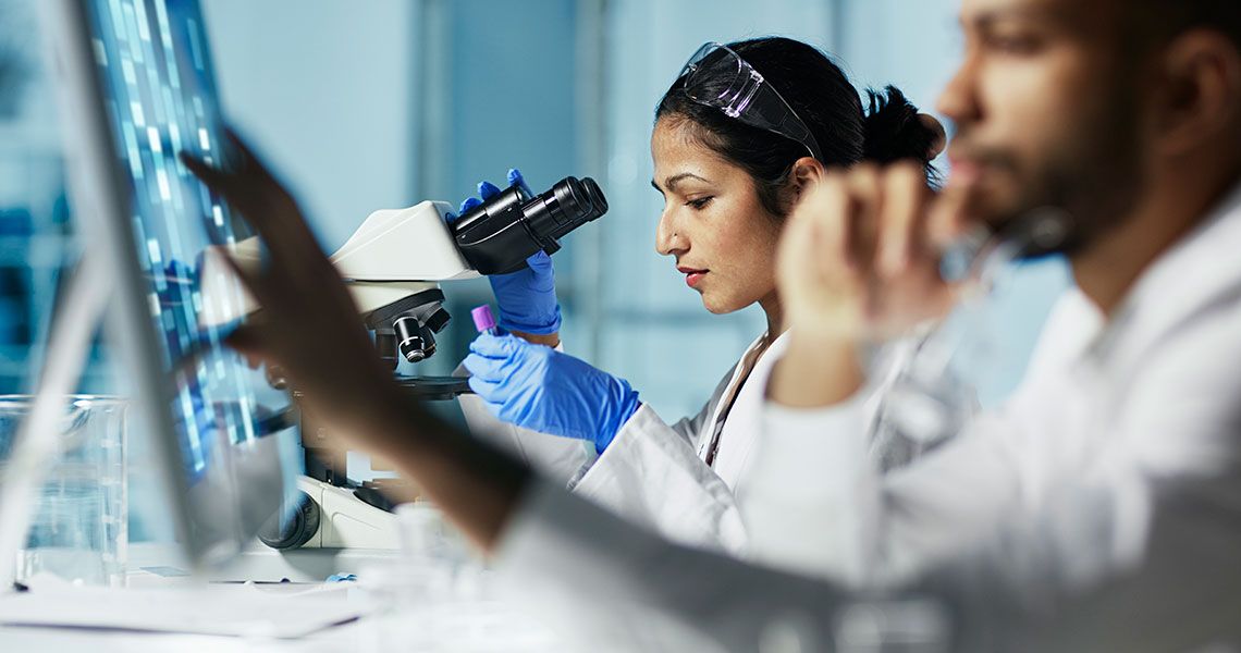 Two researchers working in a lab