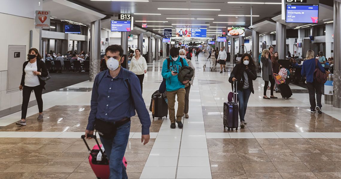 Passengers walking in an airport terminal