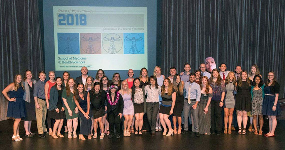 The GW PT class of 2018 standing together on a stage