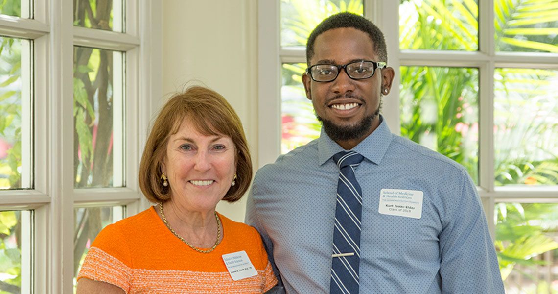 Adopt-a-Doc donor, Joanne Crantz, MD '79, and medical student Kurt Isaac-Elder smile together