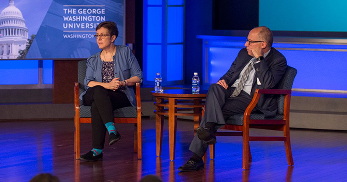 Drs. Cynthia Tracy and Jonathan Reiner sitting on stage of the Frontiers in Medicine event