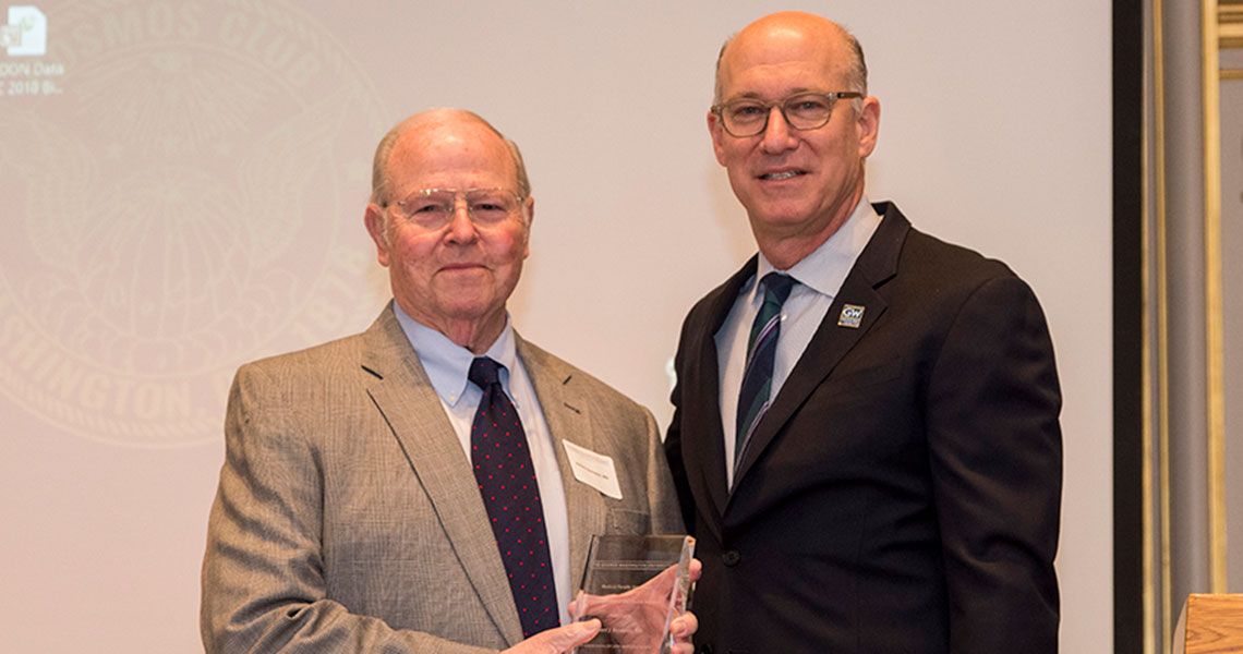 Dr. Robert J. Neviaser holding an award next to Dr. Jeffrey S. Akman