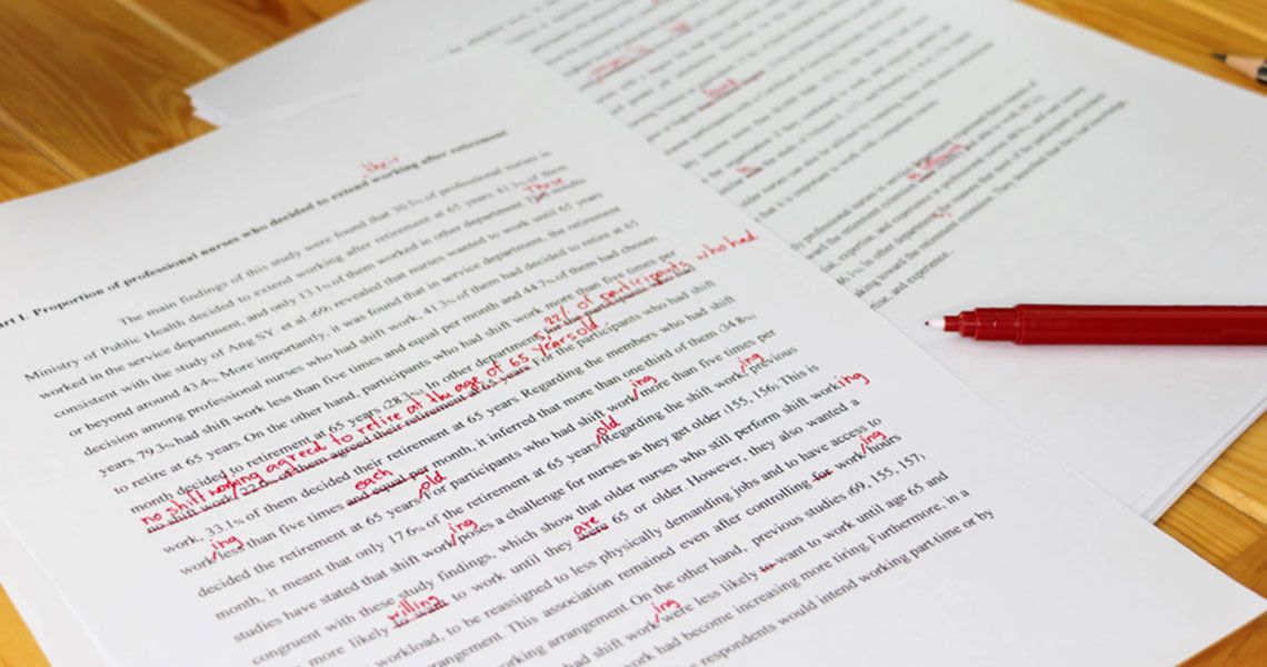 An essay marked with edits in red ink