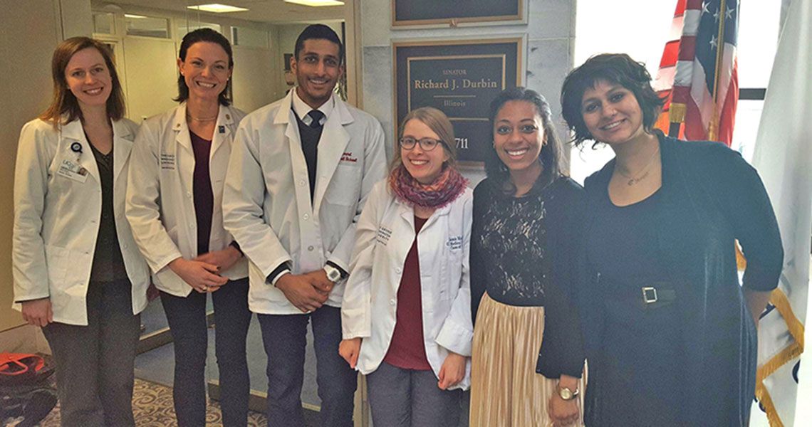 Students pose with legislative aides from Senator Dick Durbin's (D-Ill.) office during the #ProtectOurPatients campaign