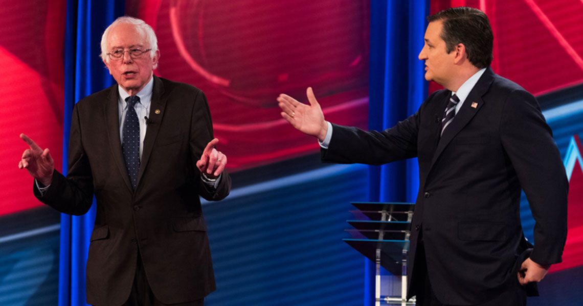 U.S. Senators Bernie Sanders and Ted Cruz debating on a stage