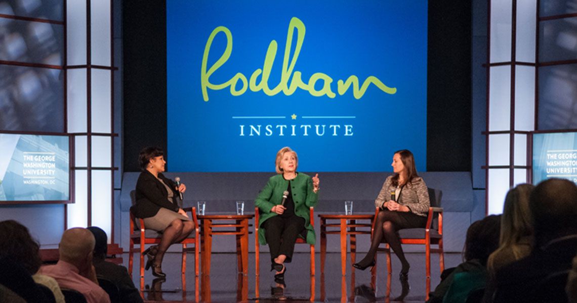 Jehan El-Bayoumi, Hillary Rodham Clinton, and Rain Henderson sitting on stage