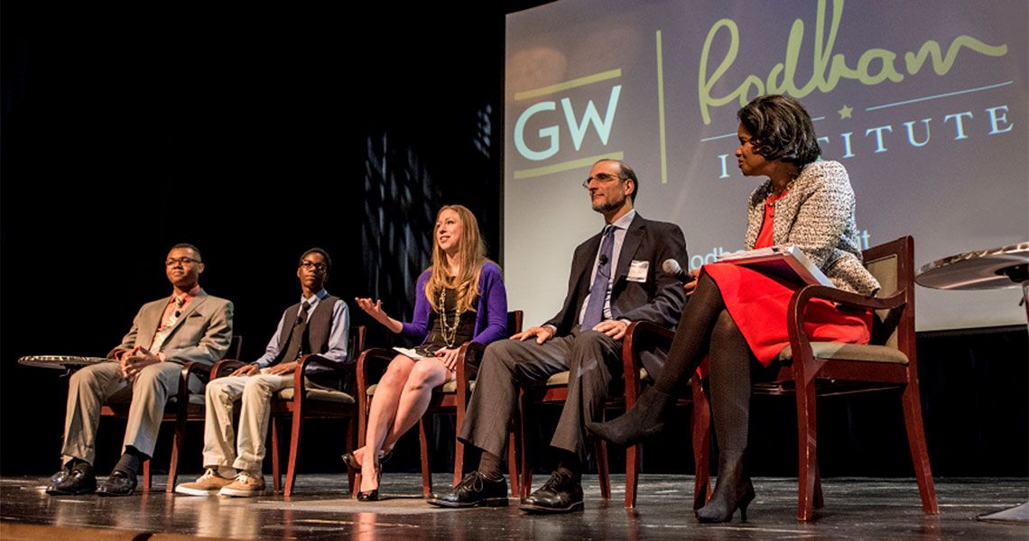 Marcus Andrews, Vertez Utley, Chelsea Clinton, Howell Wechsler, and Rea Blakely sitting on a stage