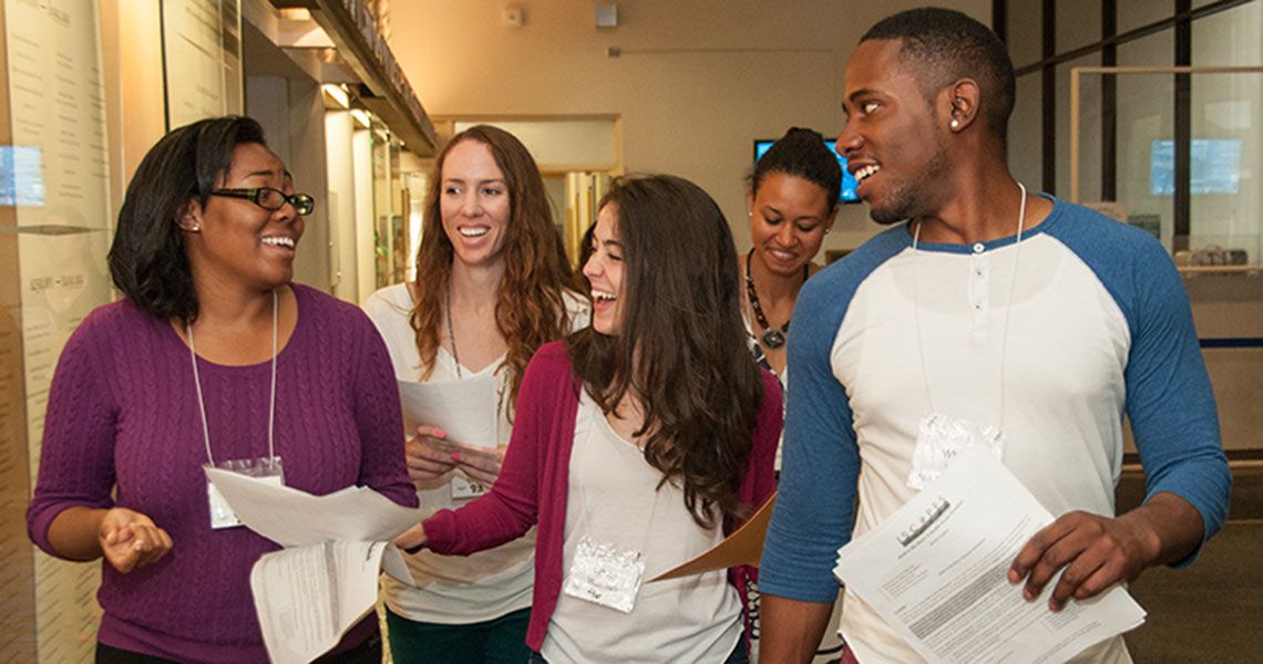 Students walk together through the Ross Hall lobby