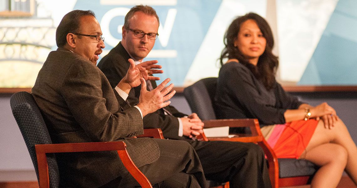 A panel of GW SMHS professors sitting on a stage