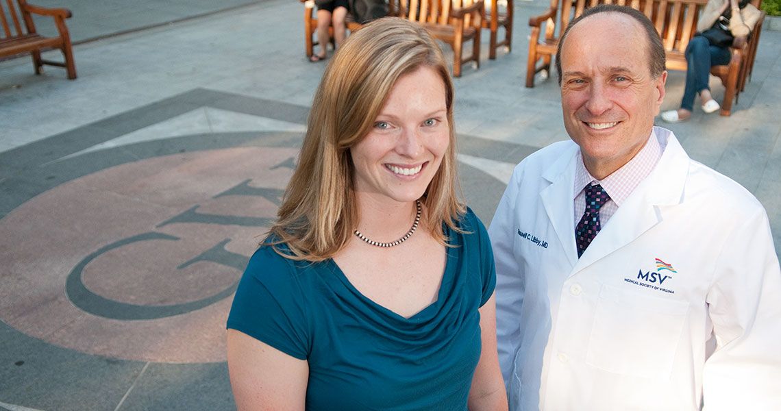 Dr. Russell Libby standing with a woman