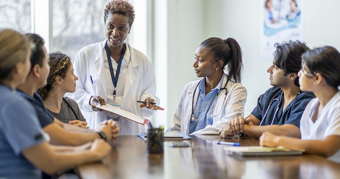 Doctor talking to students