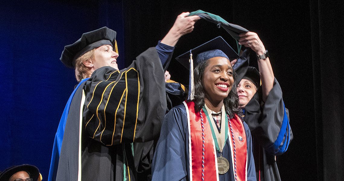 Health Sciences graduate getting adorned at graduation