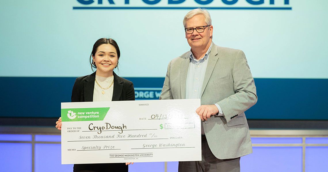 First-year medical student Iris Brammer receiving a ceremonial check