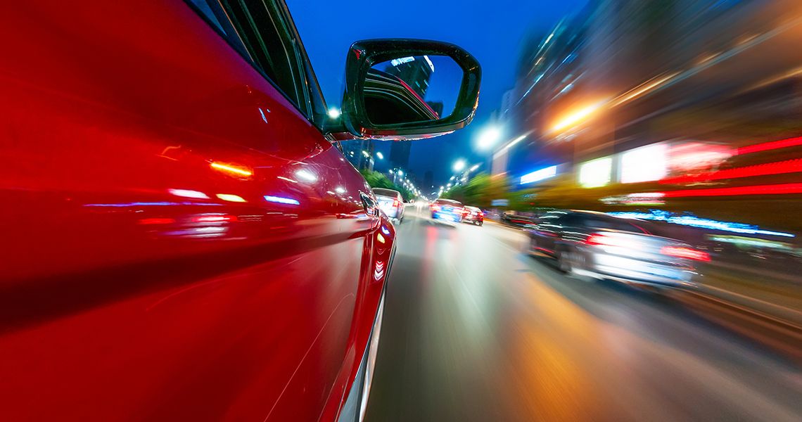 Car speeding through city streets
