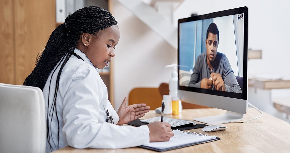 Doctor treating patient via telemedicine