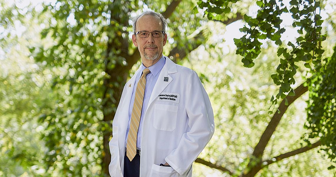 Lawrence Deyton, MD ’85, in white coat
