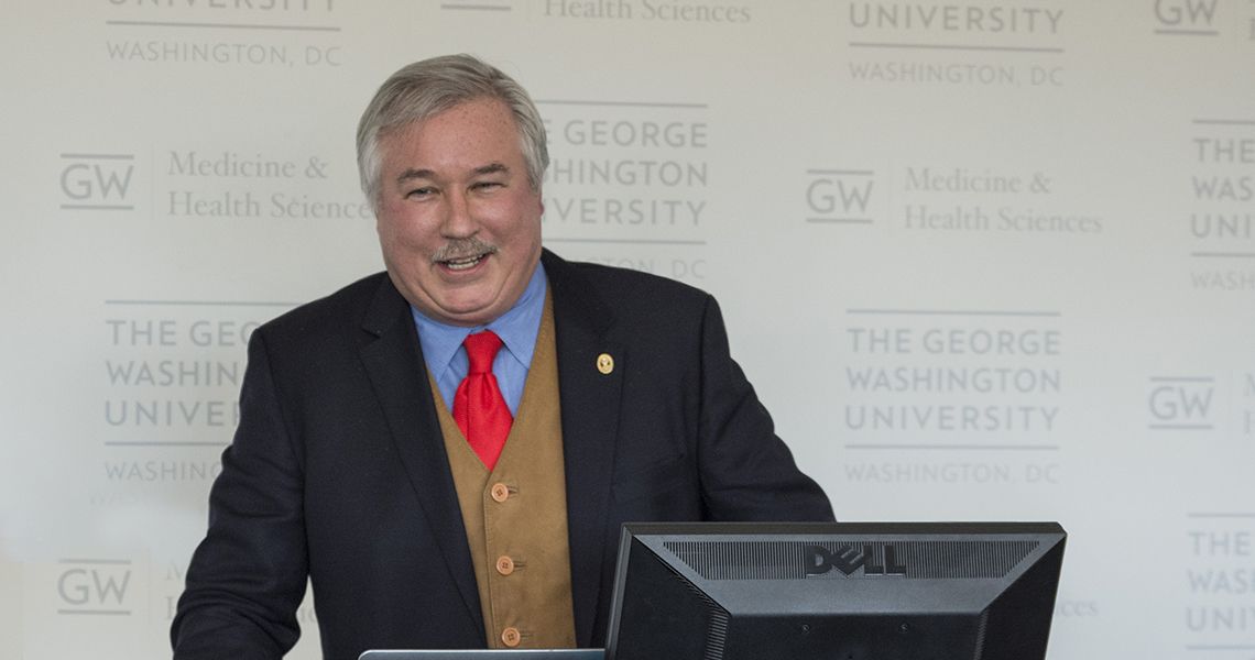 Michael Manyak, MD, at the podium during Harry C. Miller symposium