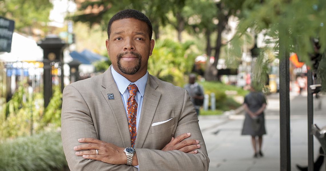 Lorenzo Norris, MD, outside Ross Hall, arms crossed