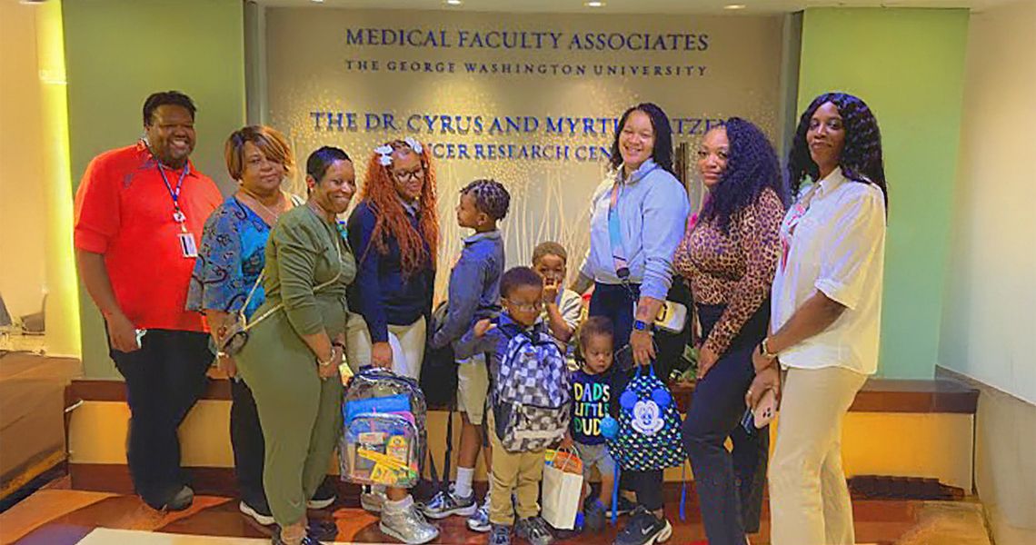 GW Cancer Center staff deliver backpacks for patients' kids 