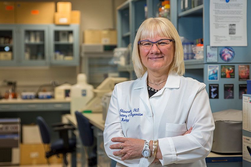 Dr. Anne Chiaramello stands in a laboratory