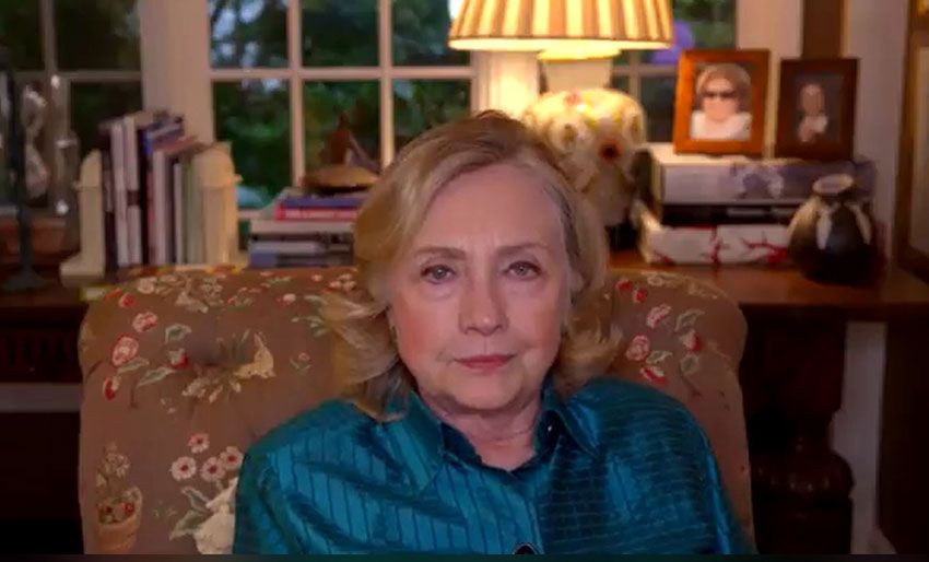 Hillary Clinton sitting at home during a webinar with the GW Rodham Institute