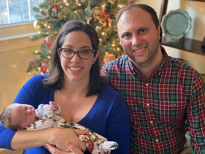 William Fenner Griffin standing with his wife and baby