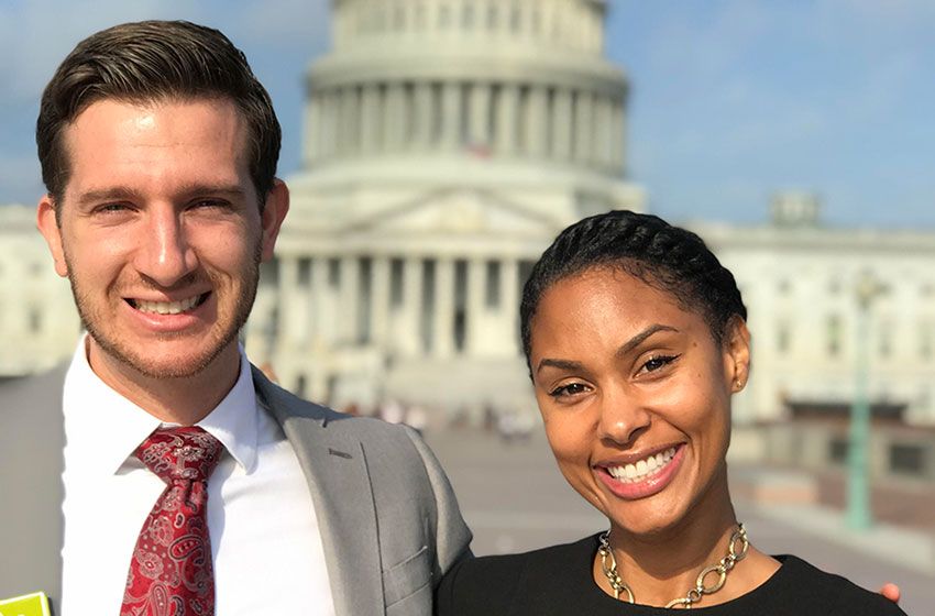 Tatum Little and Bradley Cundiff stand together in front of the U.S. Capitol 