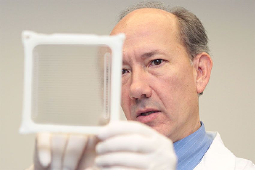 Dr. Timothy McCaffrey inspecting a sample in a lab