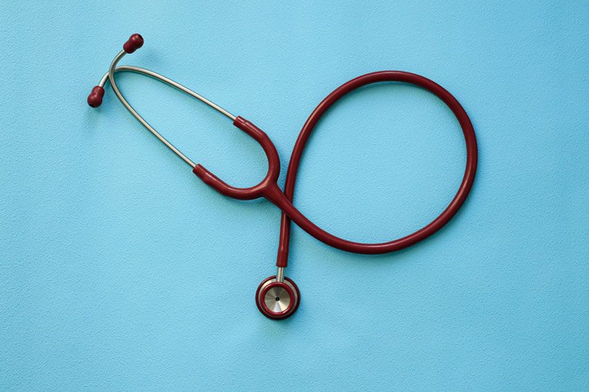 A stethoscope resting on a blue table