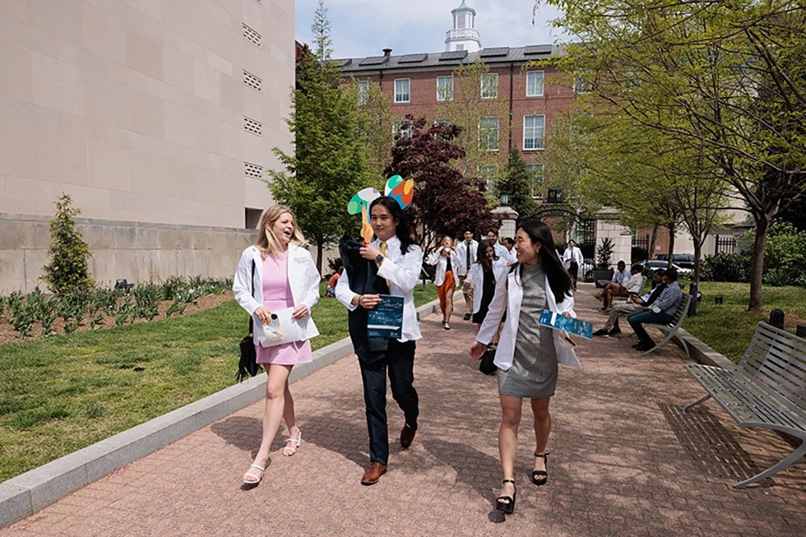 Students walking outside after the 2024 White Coat ceremony