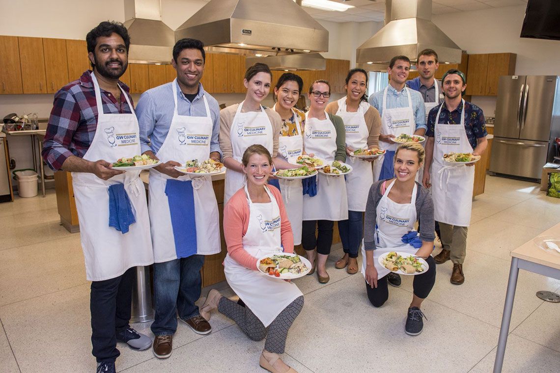 GW Culinary Medicine students standing with their cooked dishes