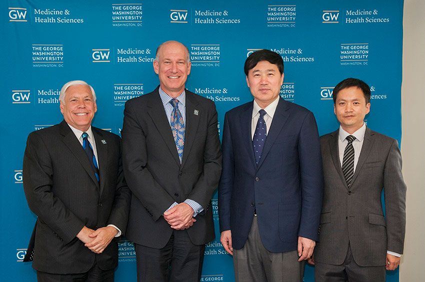 Barry Wolfman, Jeffrey S. Akman, Yu-Cun Liu, and Peng-Yuan Wang standing together