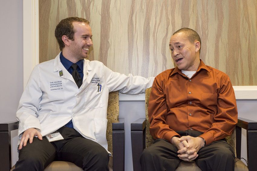 Medical student Jacob Lambdin sitting next to kidney patient Andrew Lewis