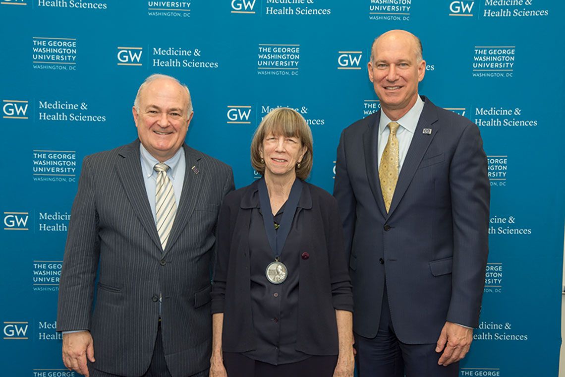 Drs. Steven Knapp, Patricia Latham, and Jeffrey S. Akman standing together