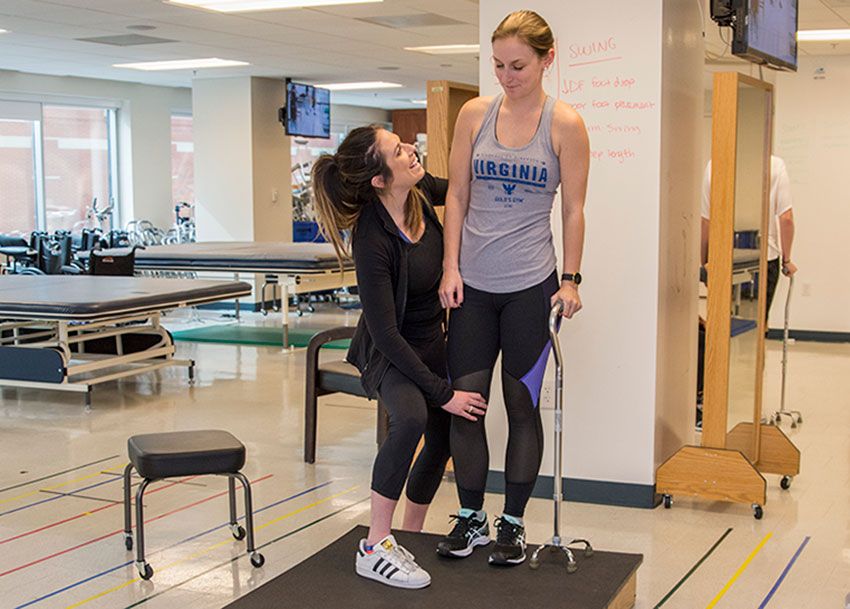 A SMHS physical therapy students working with a patient
